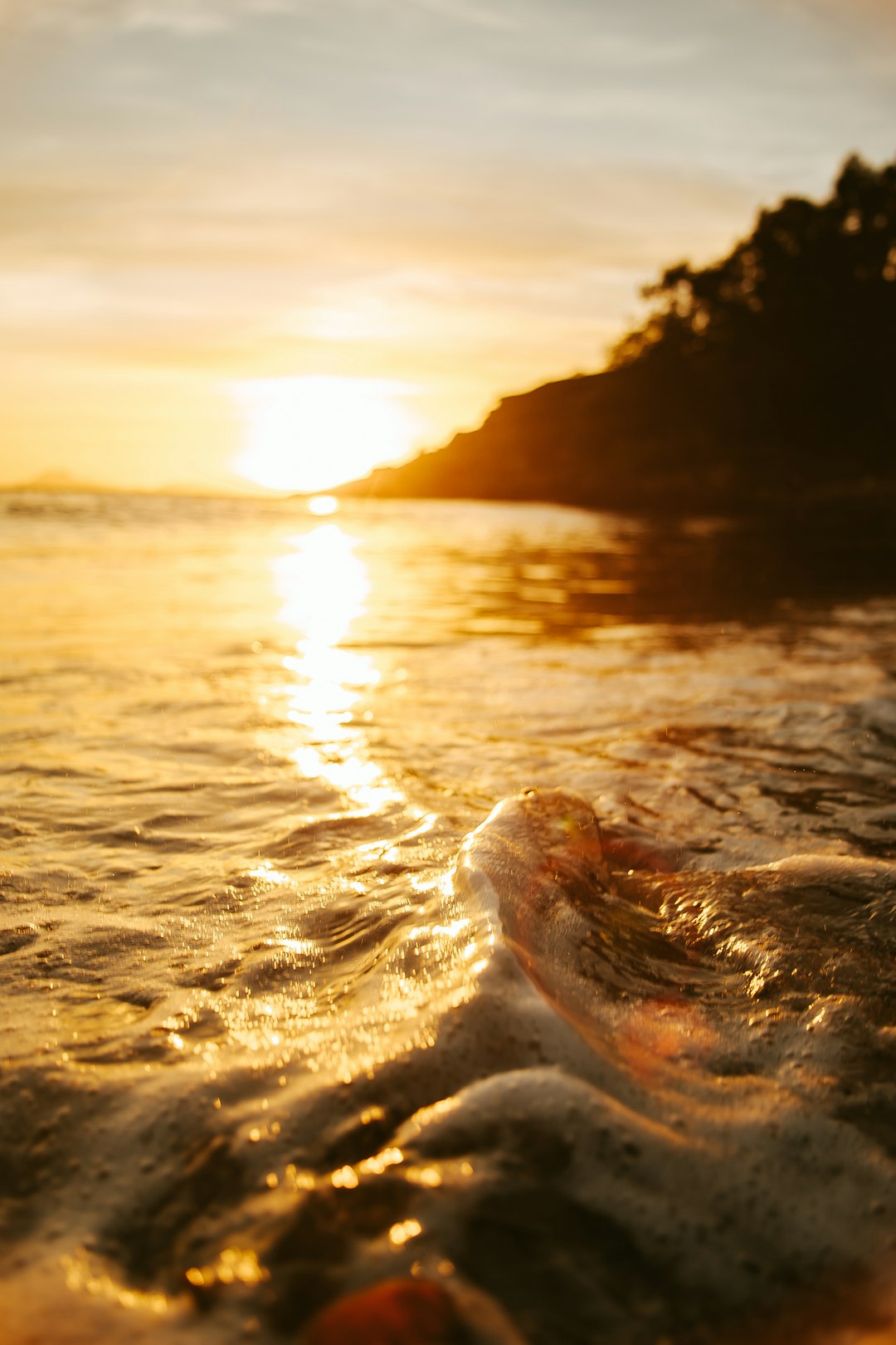 sunlight reflection on sea waves during sunset