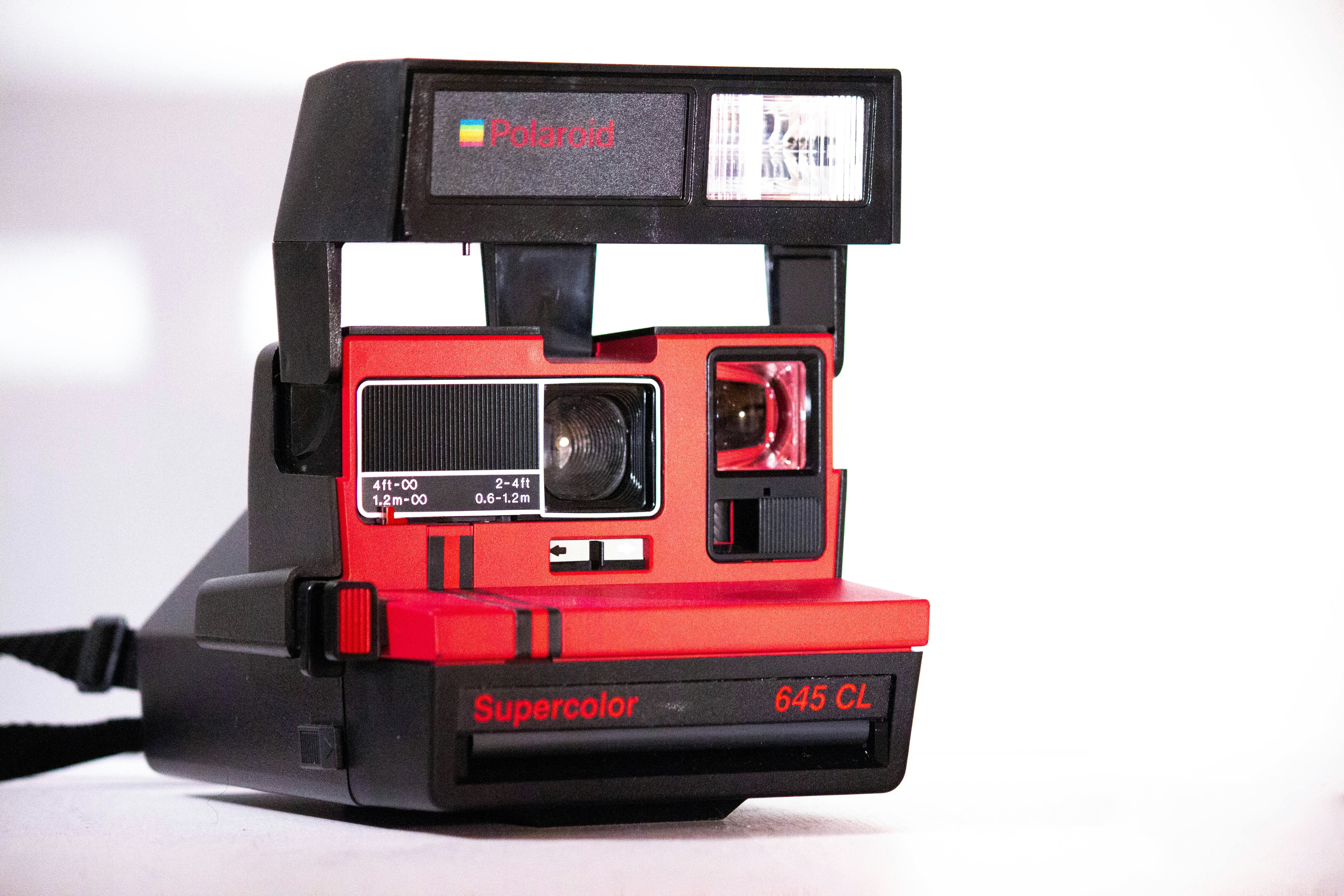 black and red Polaroid Supercolor 645 CL instant camera
