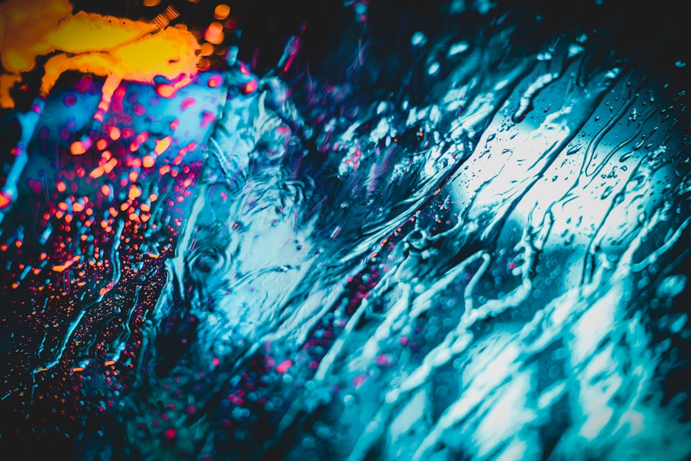 a close up of a rain covered window