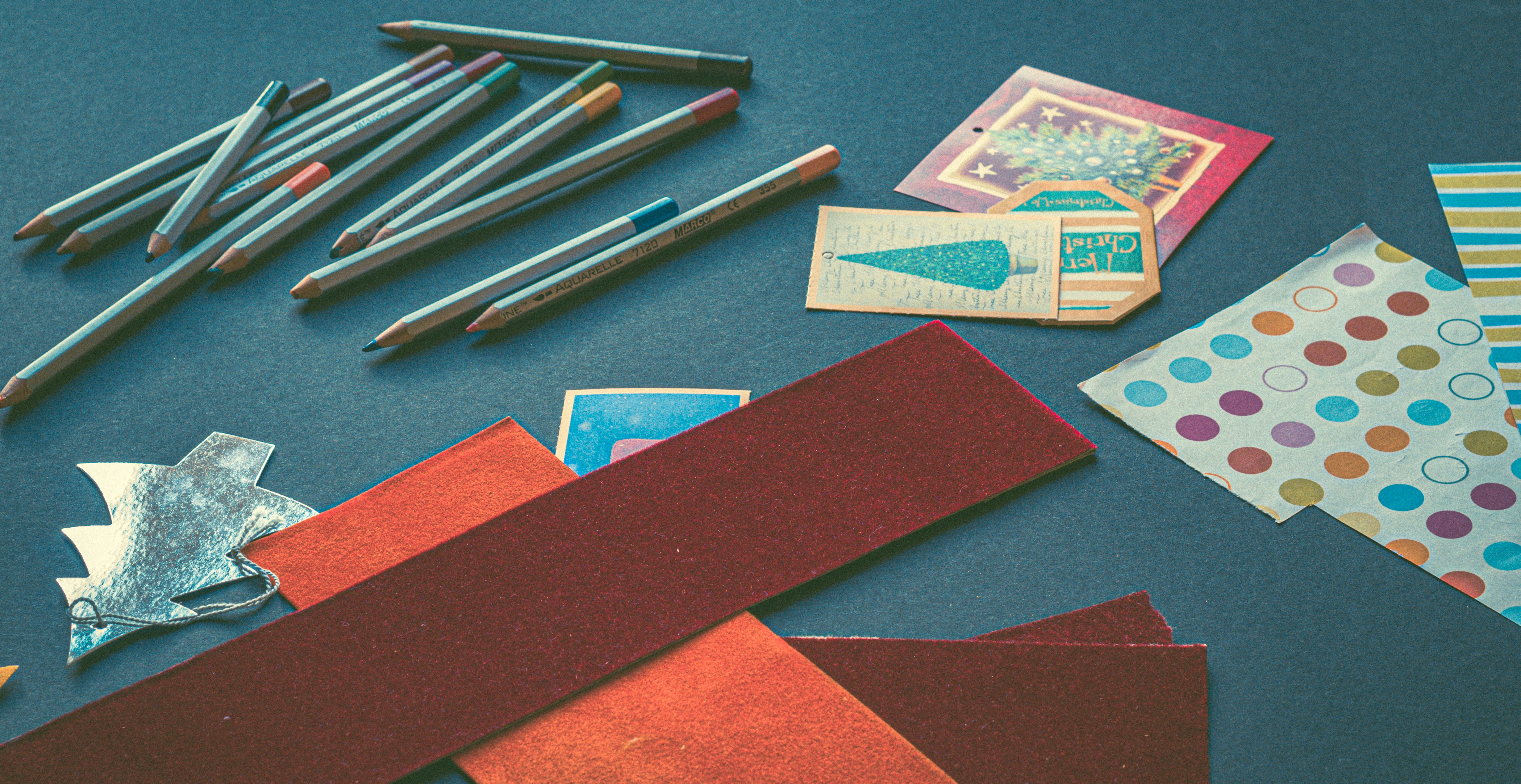 pencils and cards on gray surface
