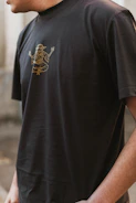 Close-up of a vibrant, hand-drawn spiritual symbol printed on a soft cotton t-shirt.