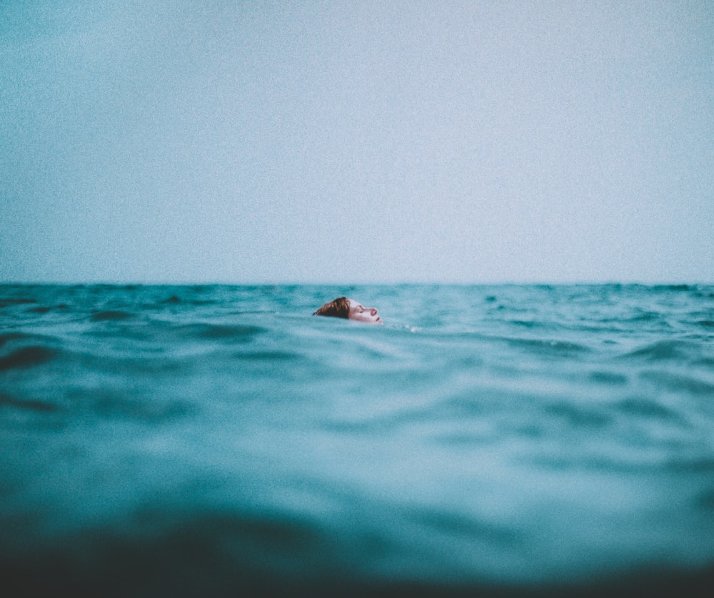 woman swimming in a body of water