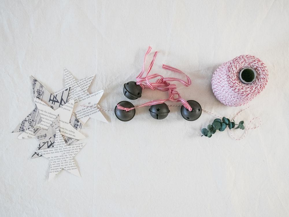 white star cut-out papers beside bells and rope