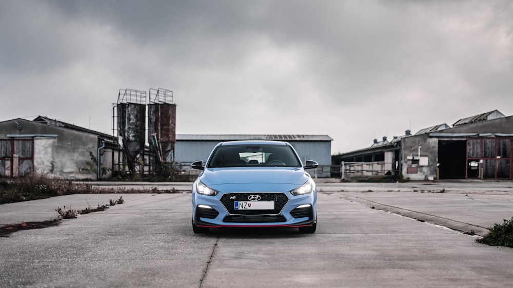 gray Hyundai car parked on concrete pavement