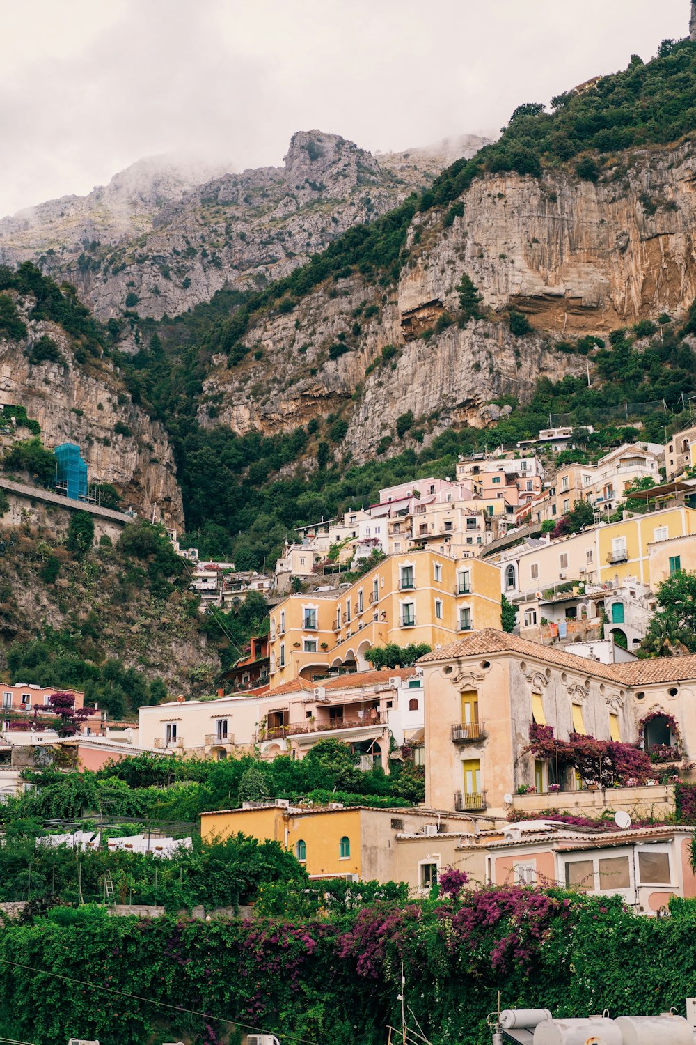 brown houses near mountain