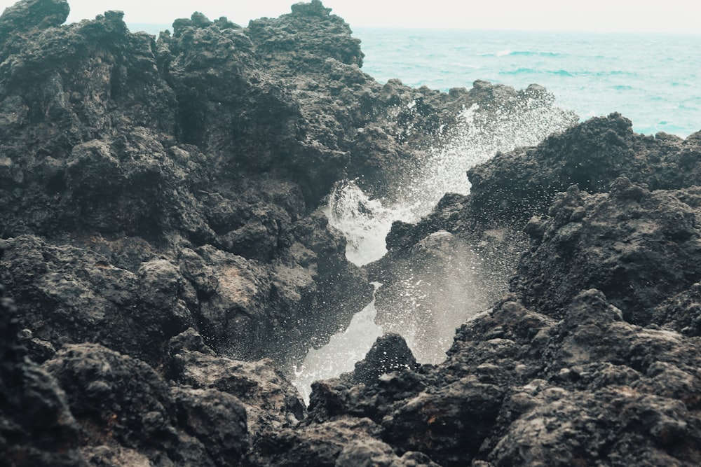 a close up of rocks near the ocean