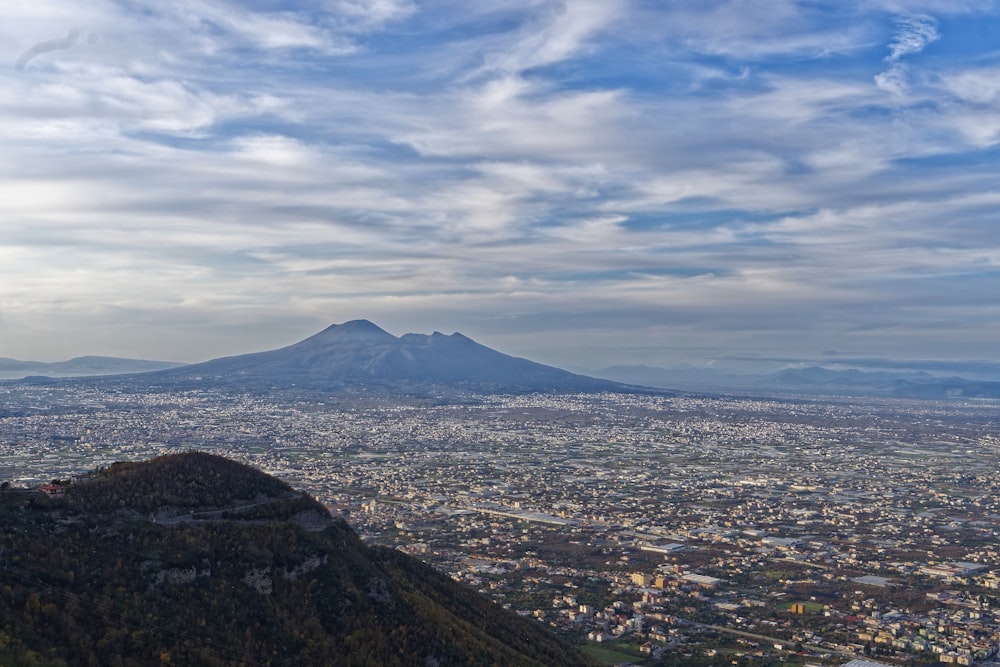 city near mountain during daytime