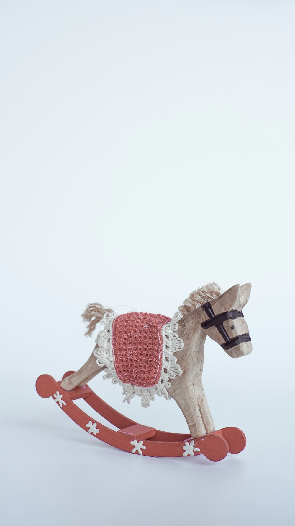 brown and red rocking horse toy