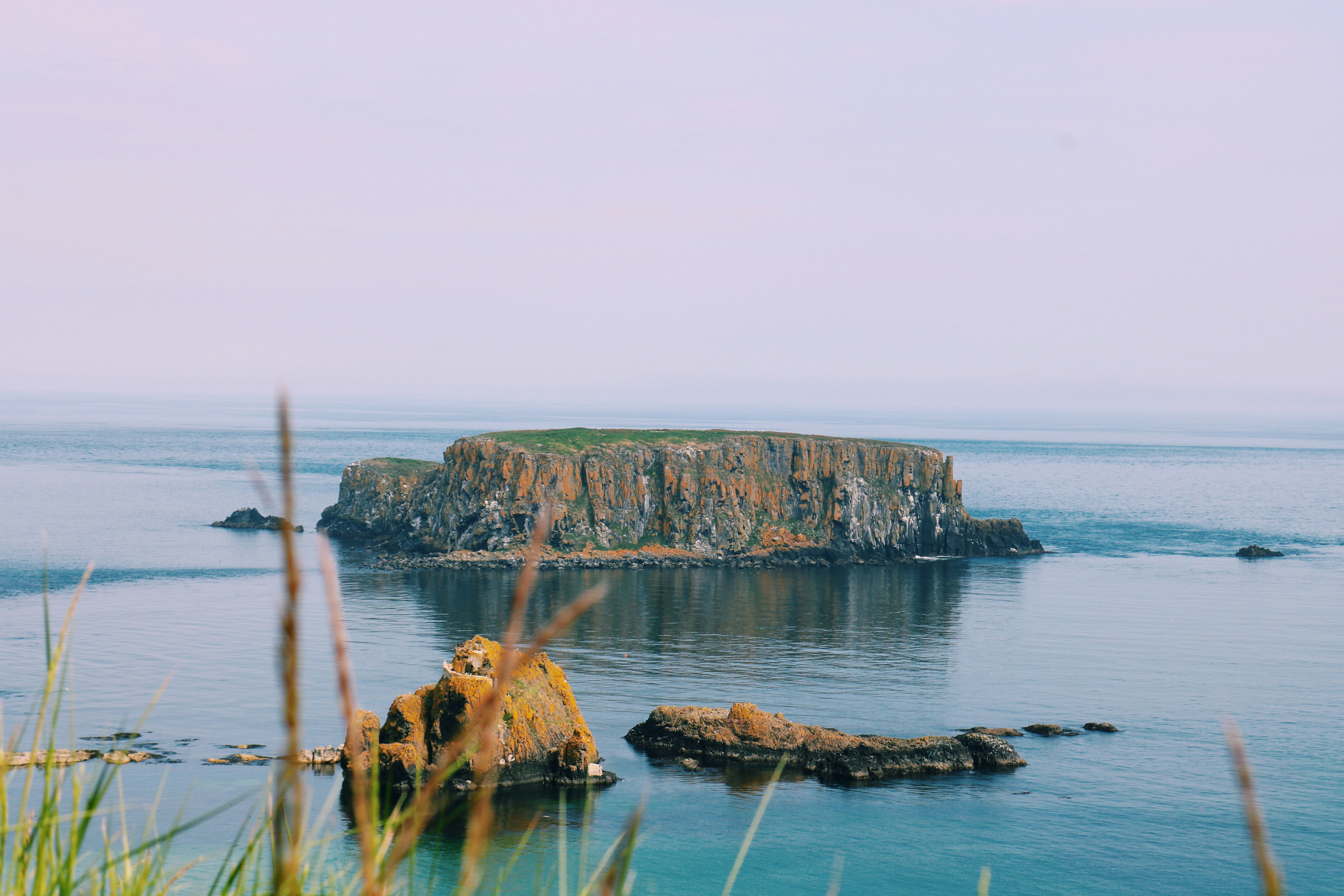 view photography of brown island during daytime