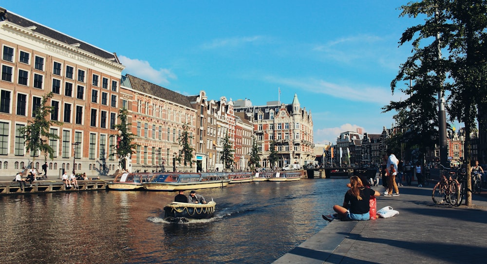 people walking beside river