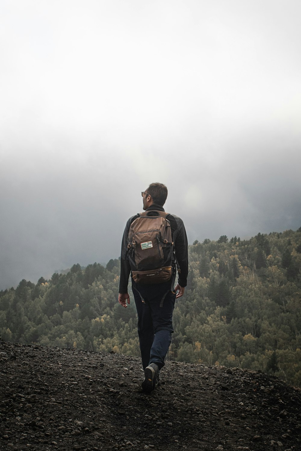 man walking on the rocky road