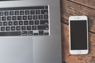 MacBook Pro beside iPhone