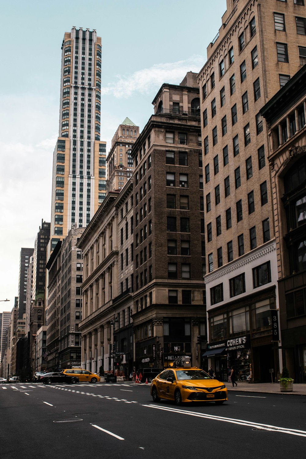 yellow car on the concrete street