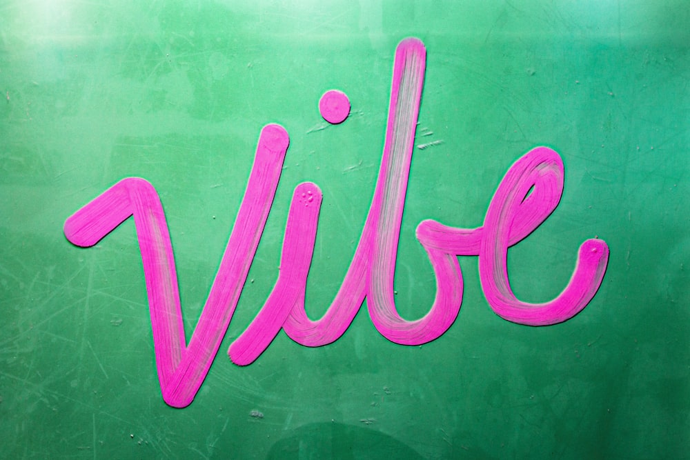 Vibe text on green surface
