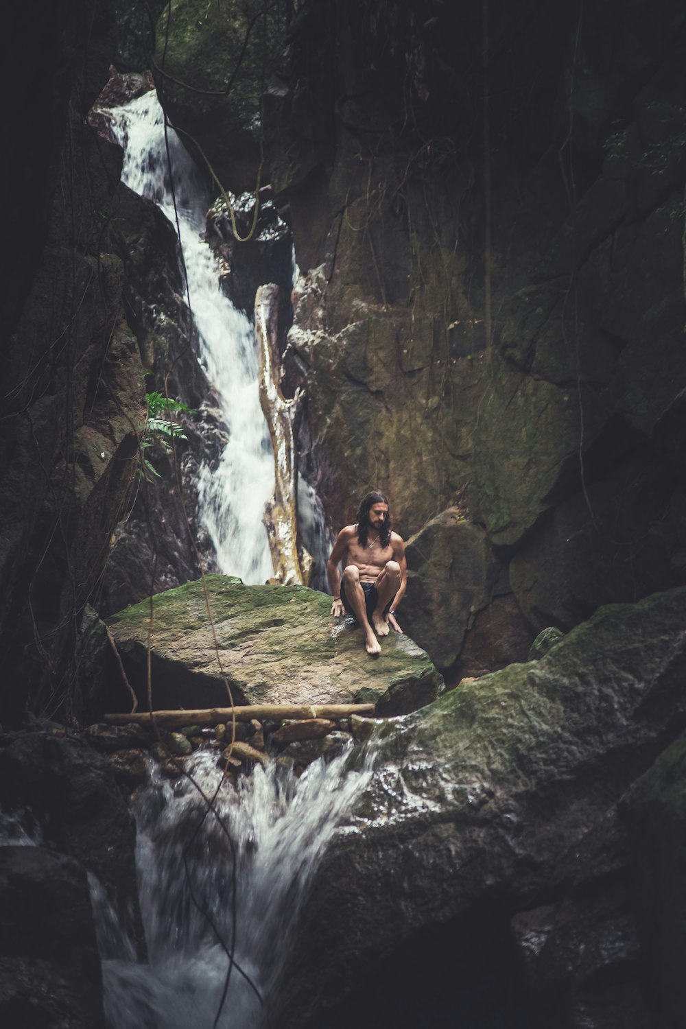 man sitting on stone