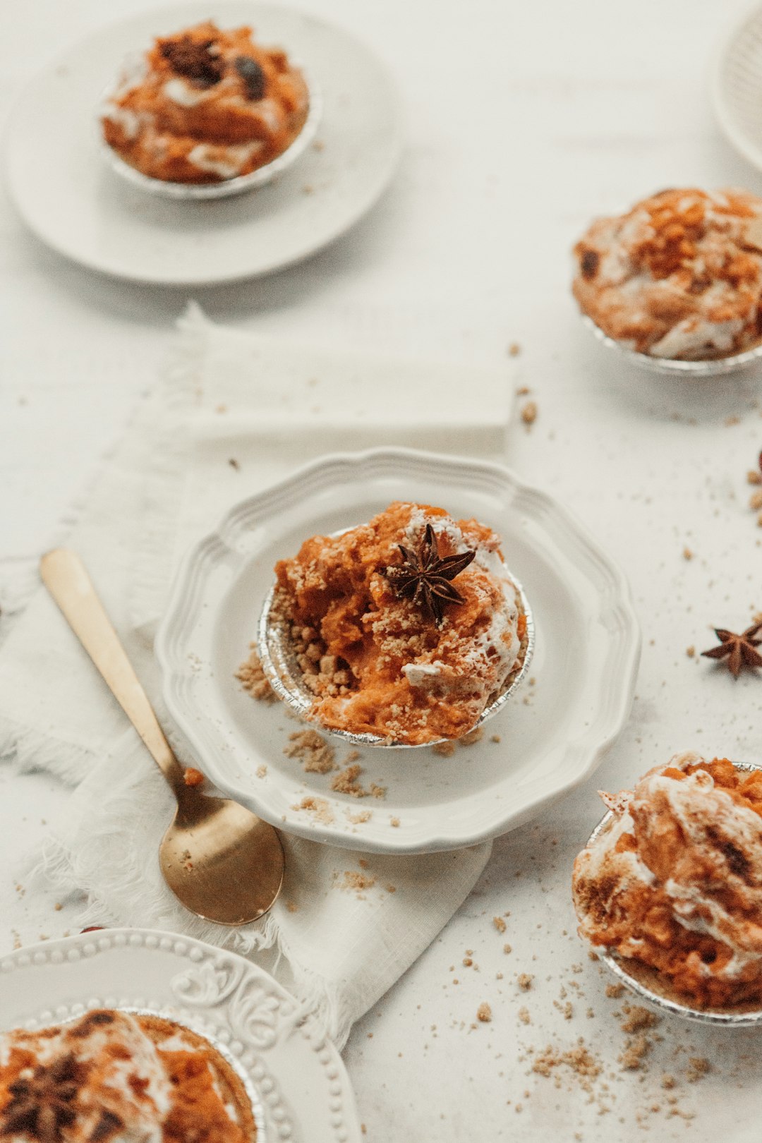 cake with star anise on top near spoon