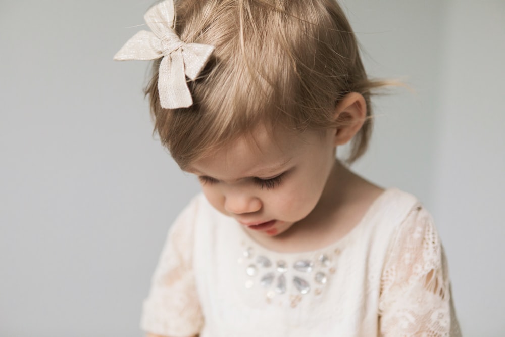 toddler in white top