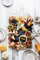 assorted fruits and vegetables on grey wooden board