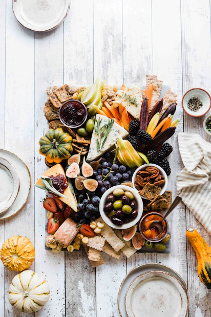 assorted fruits and vegetables on grey wooden board