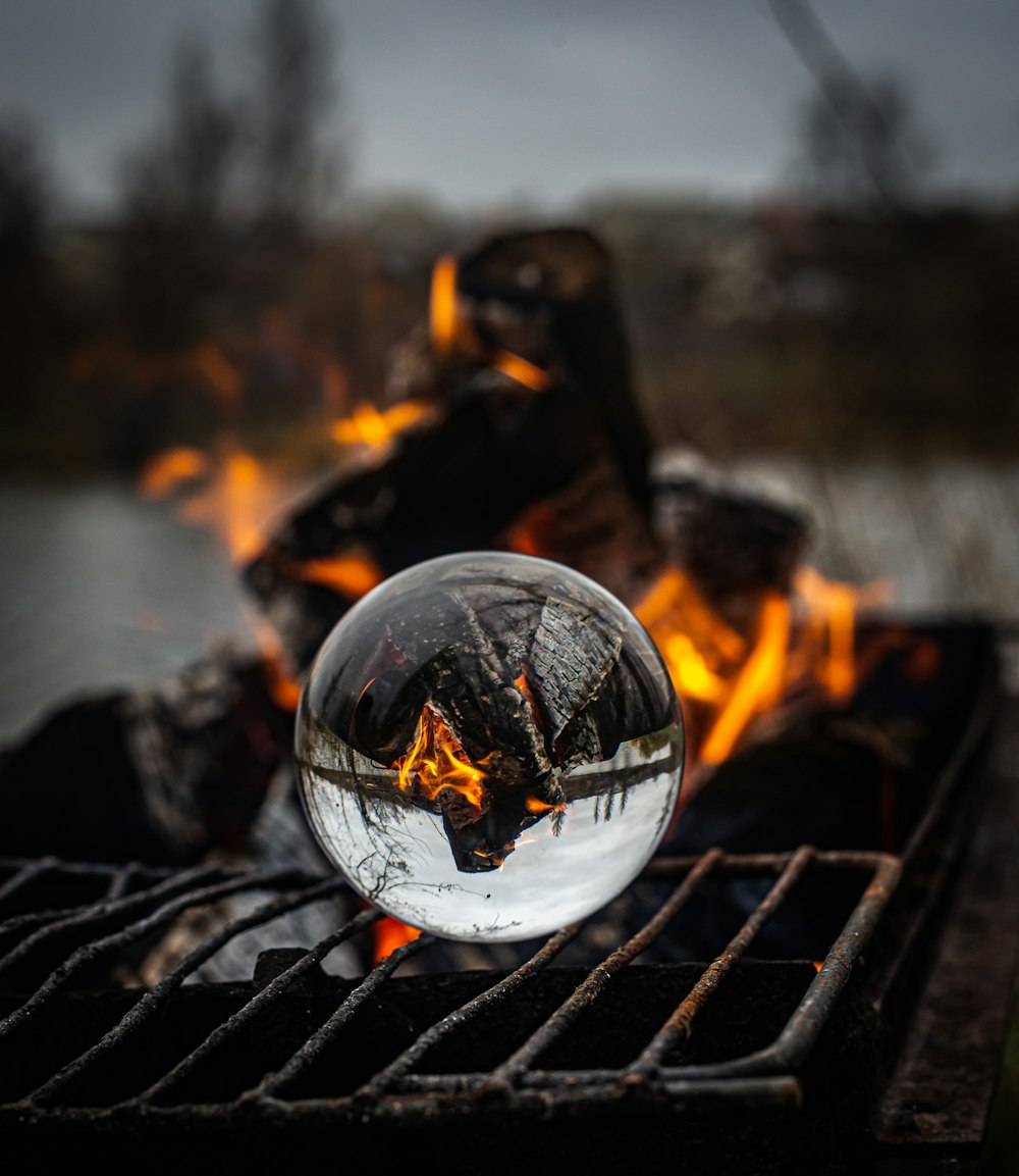 crystal ball photography of burning charcoal