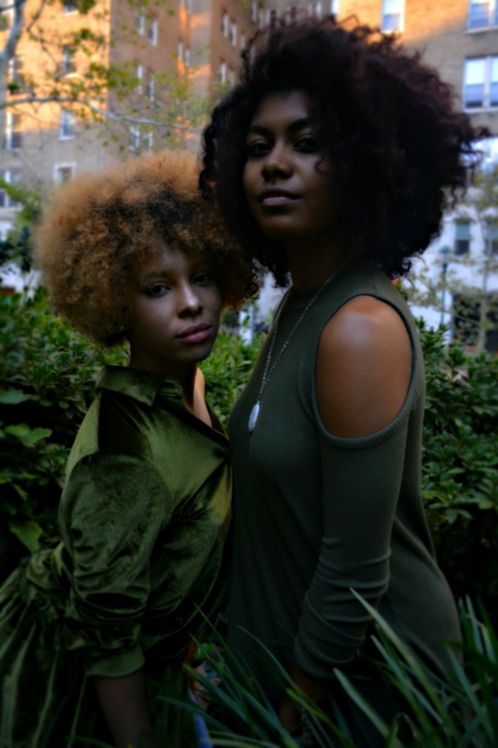 women in grass field