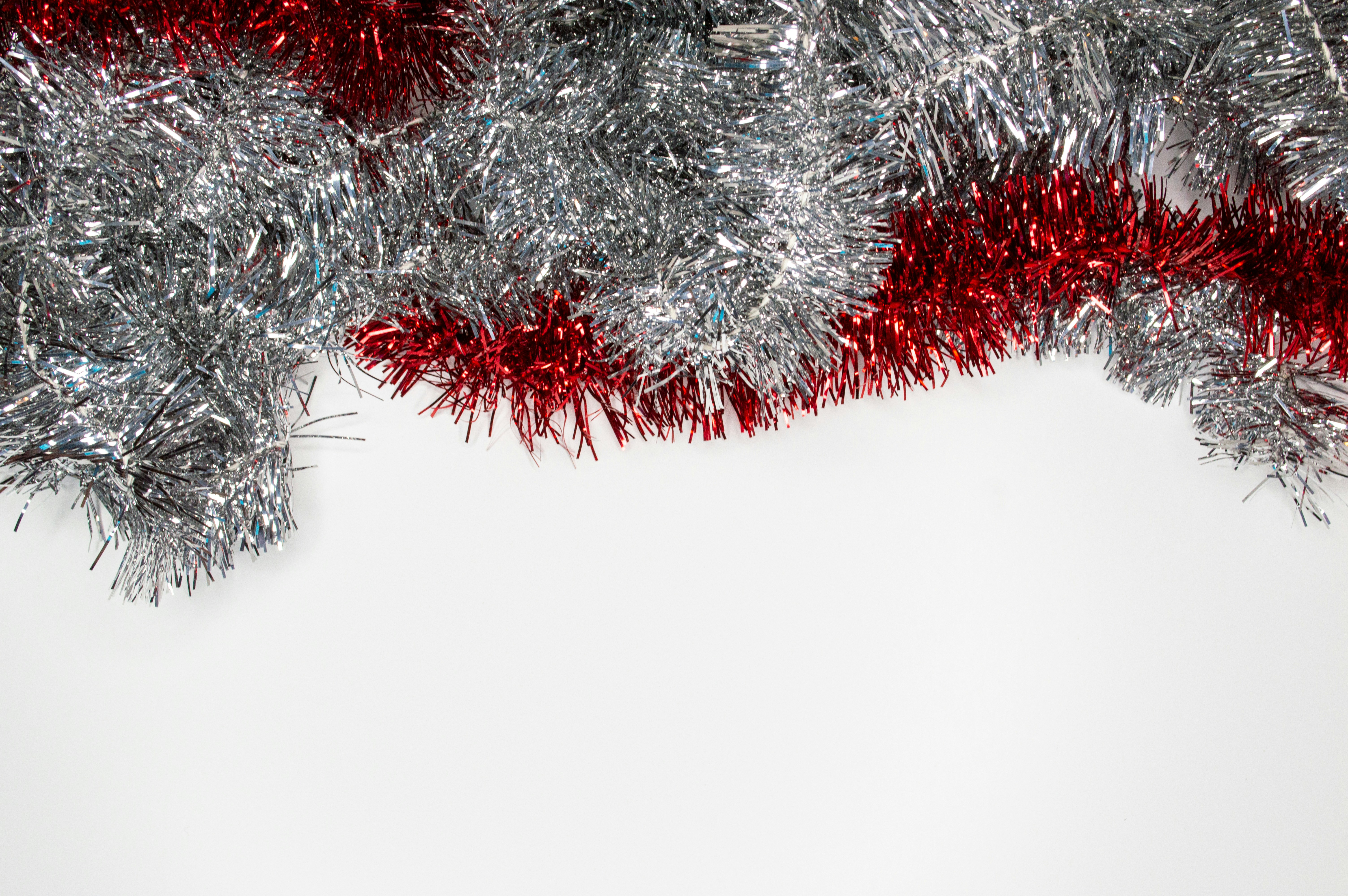 silver and red garlands tinsel teams background