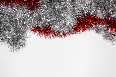 silver and red garlands tinsel teams background