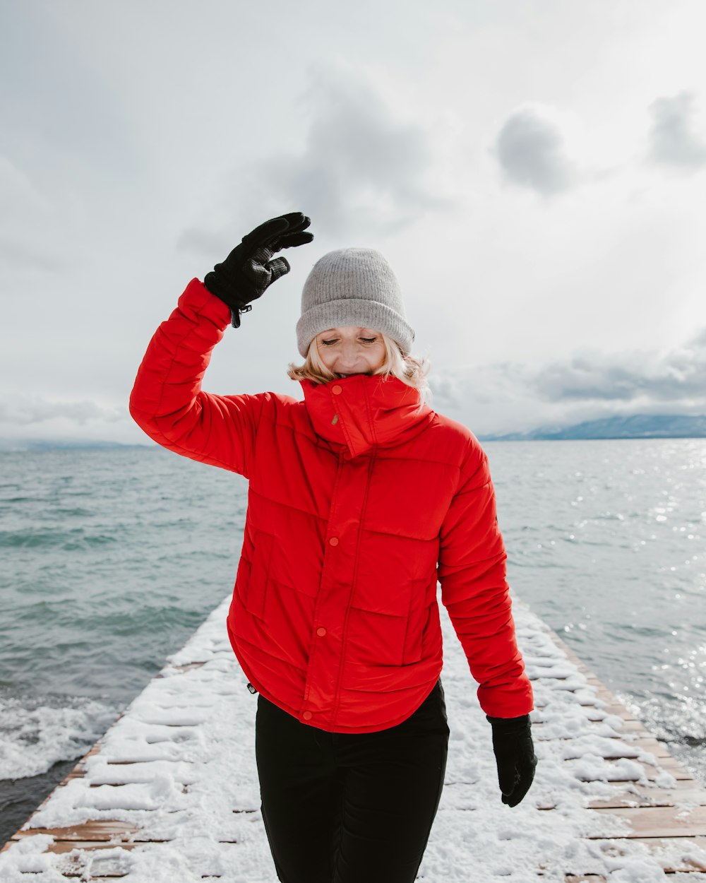 woman in red bubble jacket