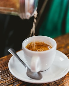 white ceramic cup with saucer
