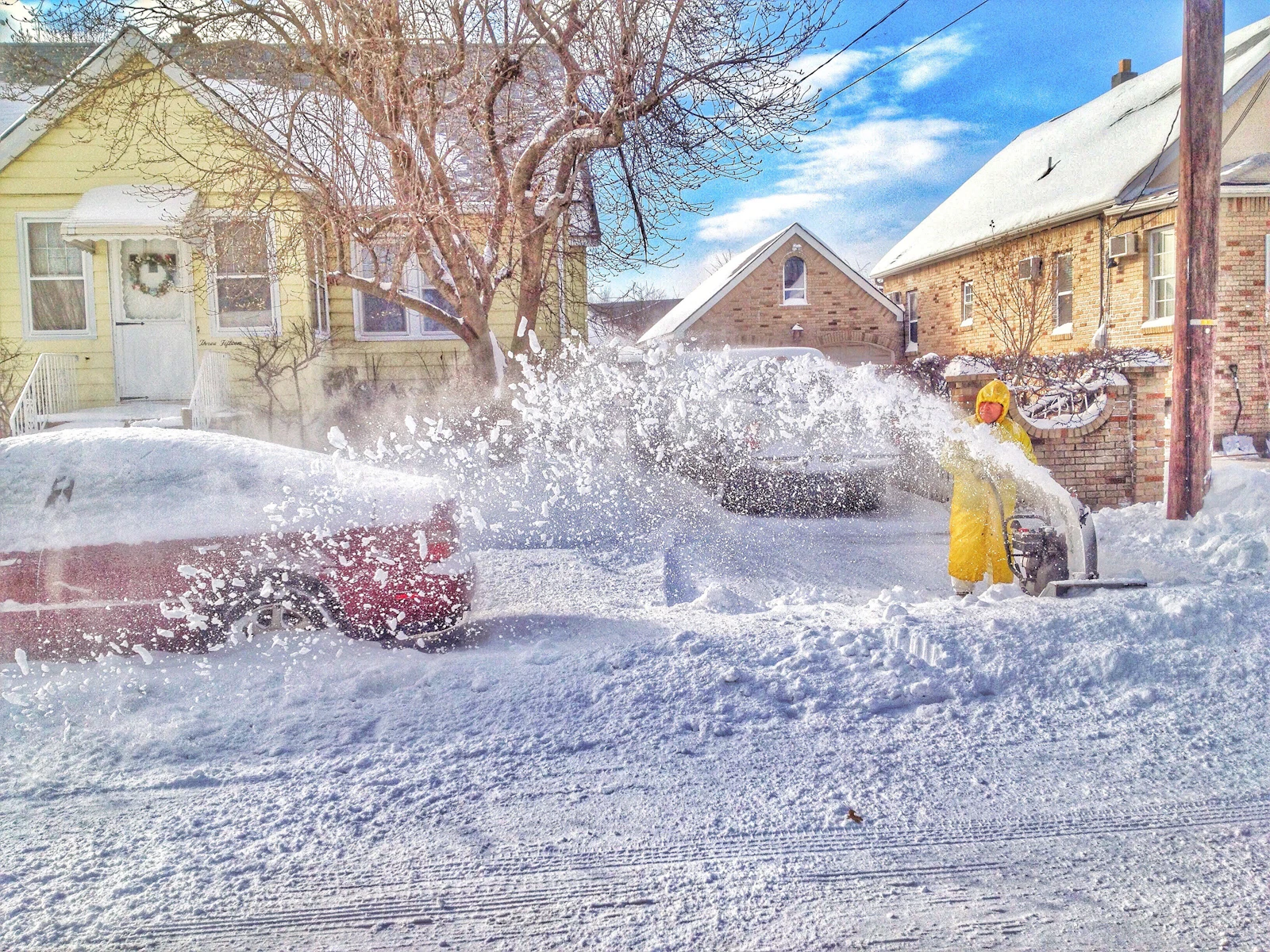 Person clearing snow with a snow thrower