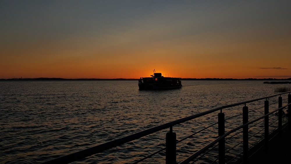 silhouette of boat on water