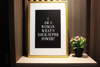 pink flower plant beside signage