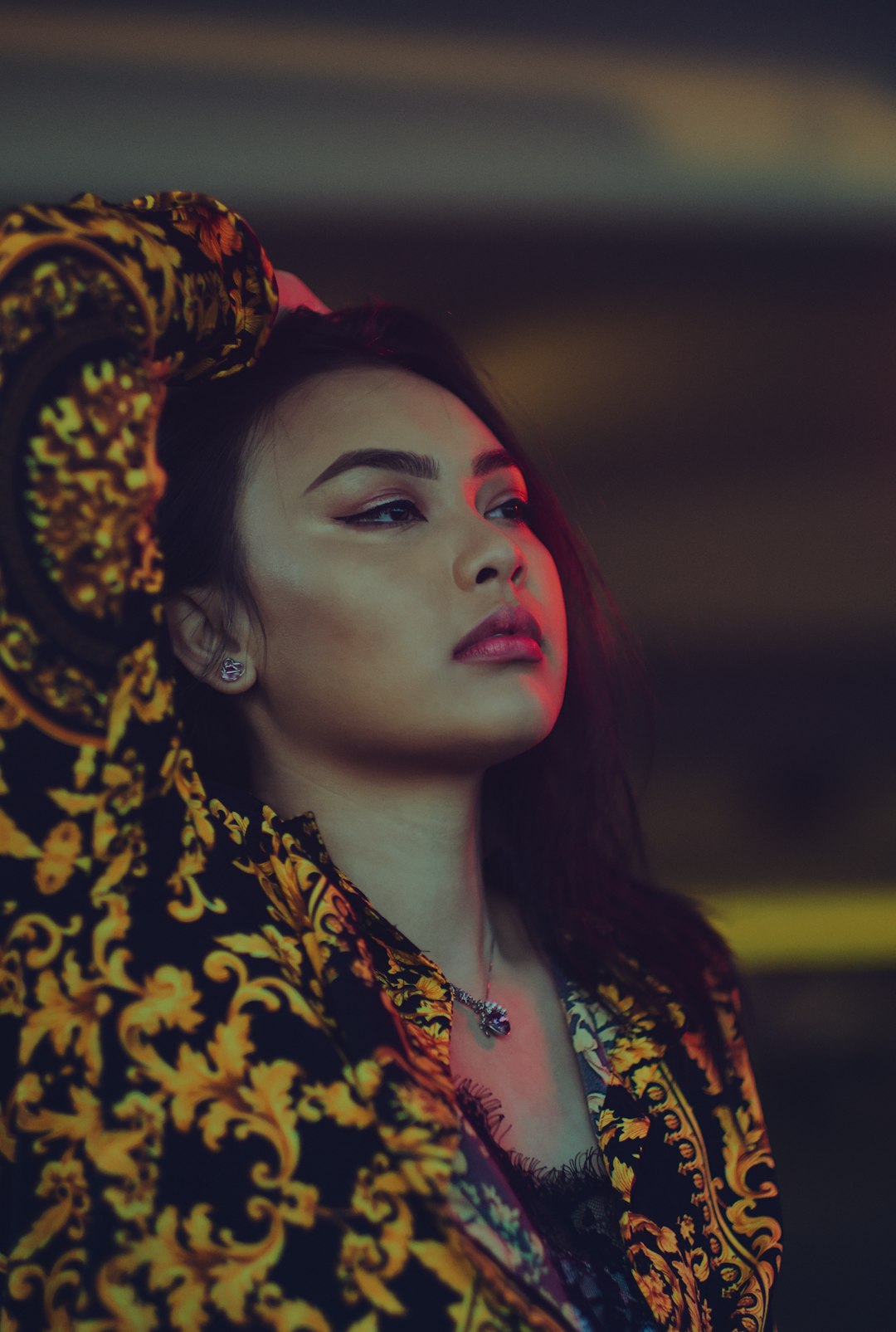 woman wearing yellow and and black floral top