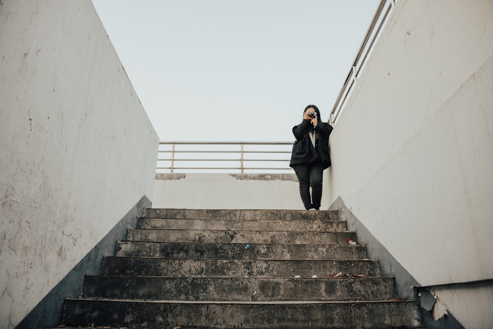 woman standing near stairs