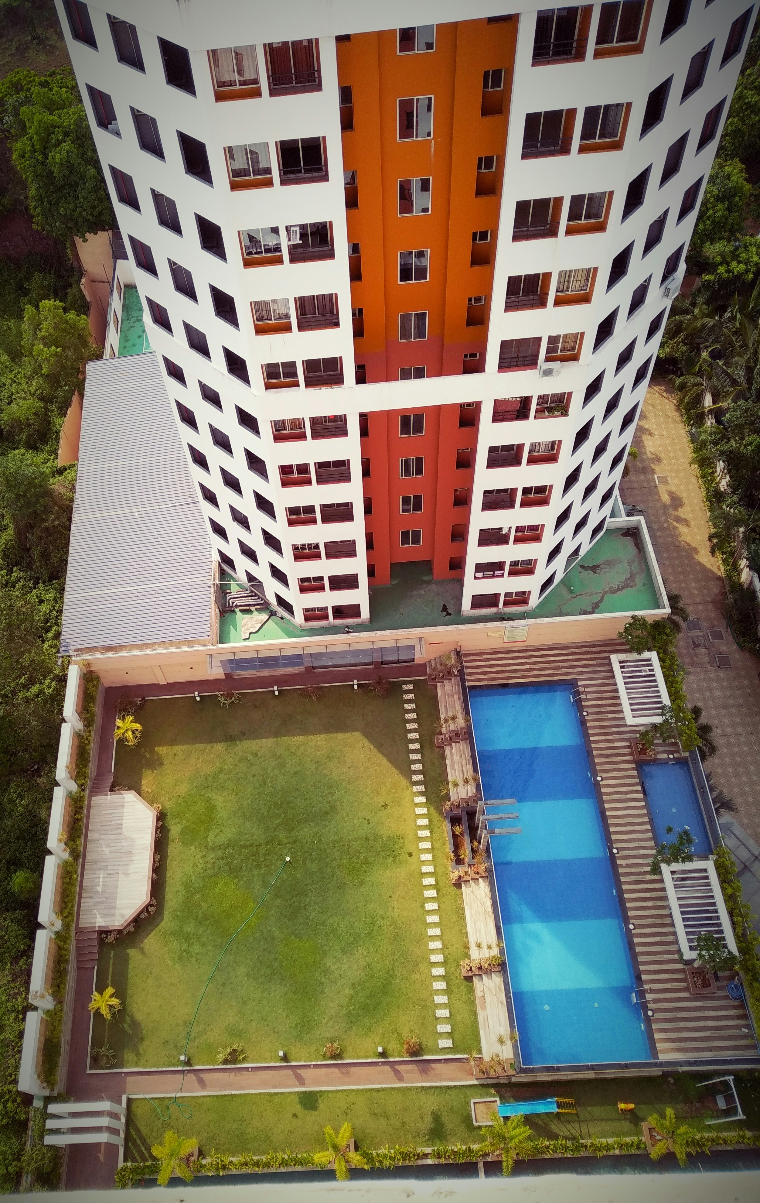 Apartment complex with swimming pool and garden