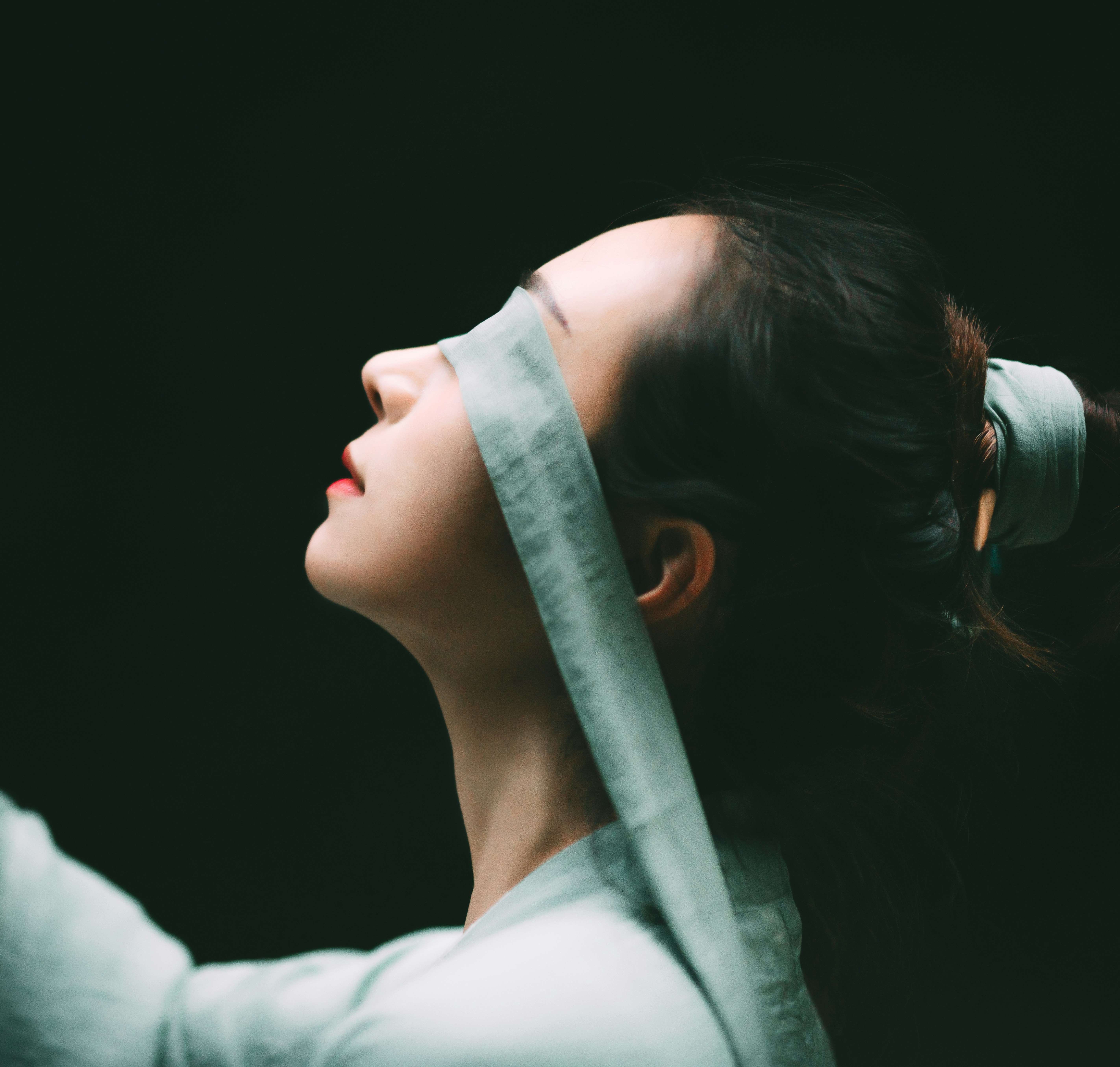 a woman with a blindfold around her head
