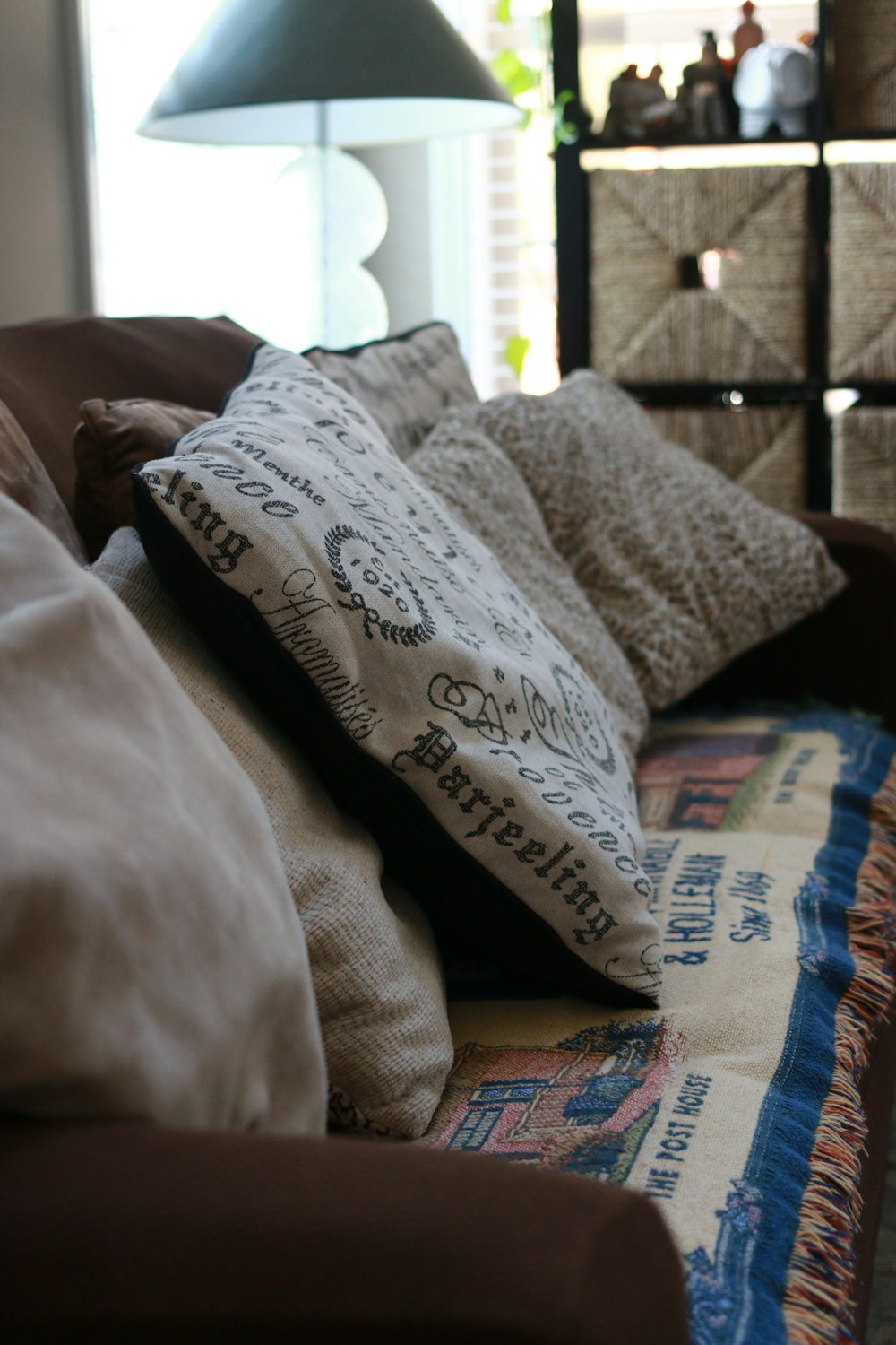 several white pillows on sofa