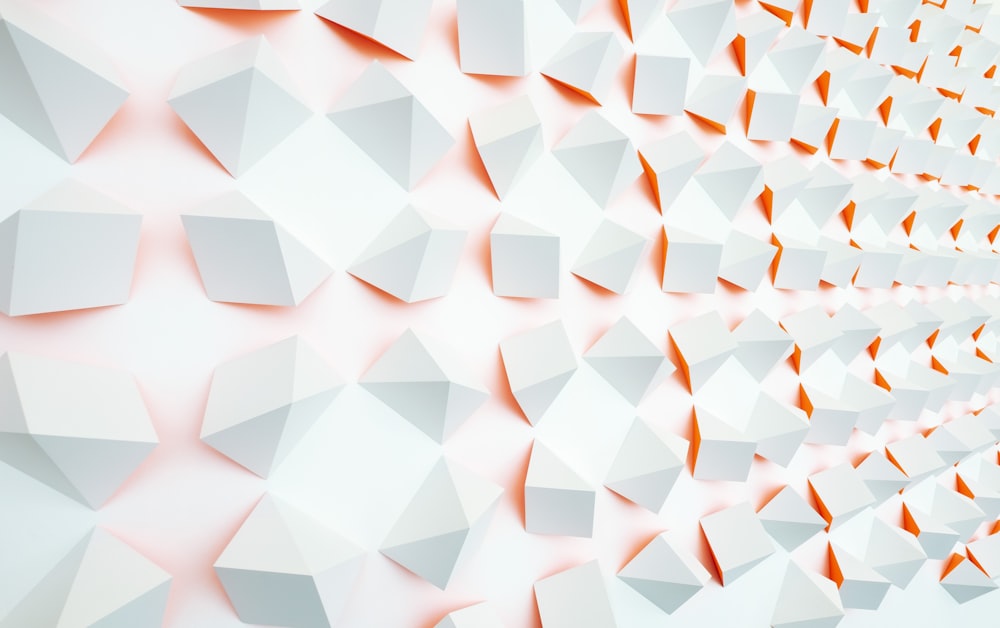 a white and orange wall with a pattern on it