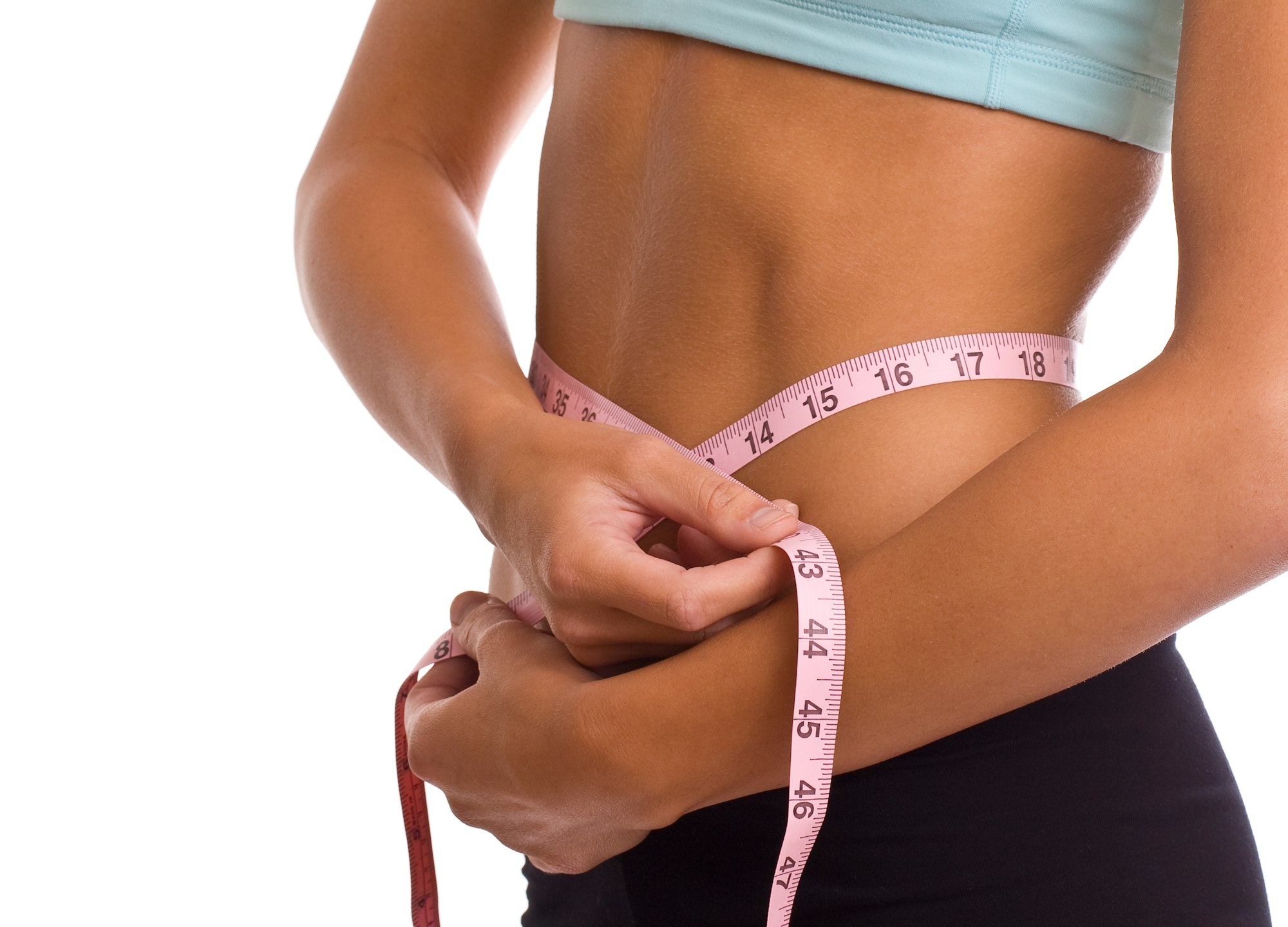 Woman measuring stomach with measuring tape. Concept for fitness and diet.