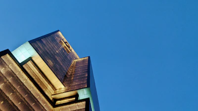Evening shot of a commercial building illuminated against the night sky.