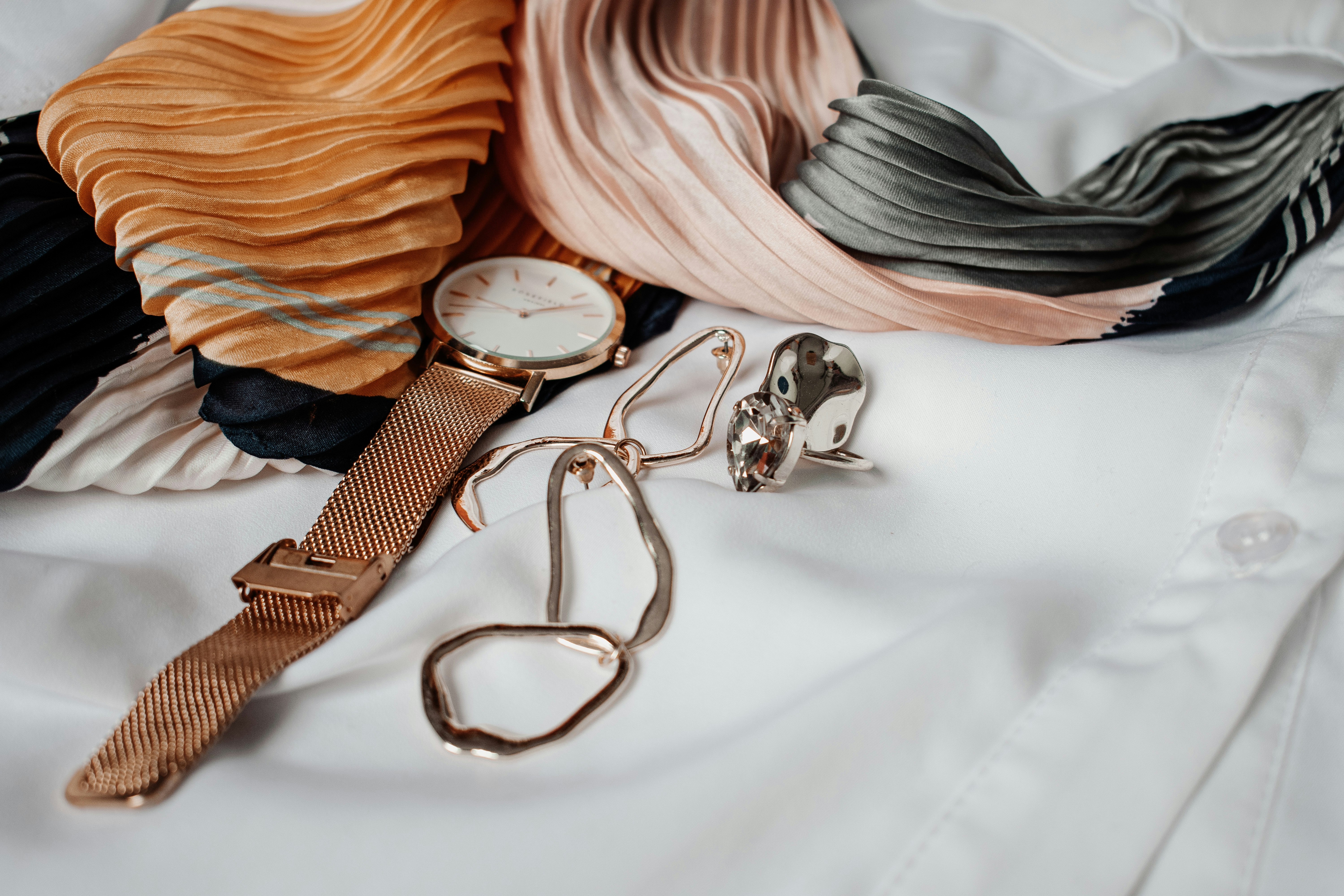 White and gold analog watch