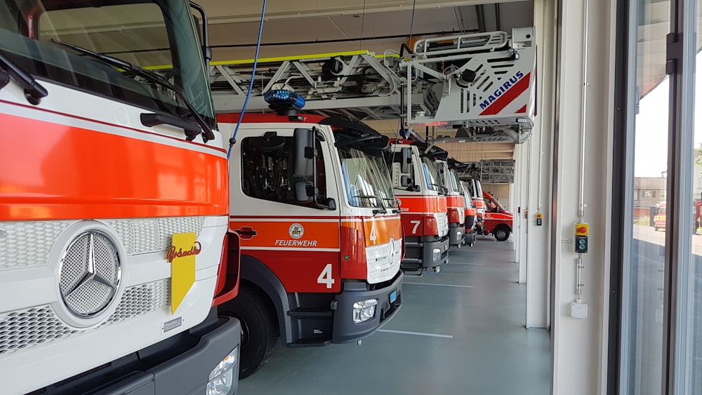 white-and-orange vehicles inside buildinig