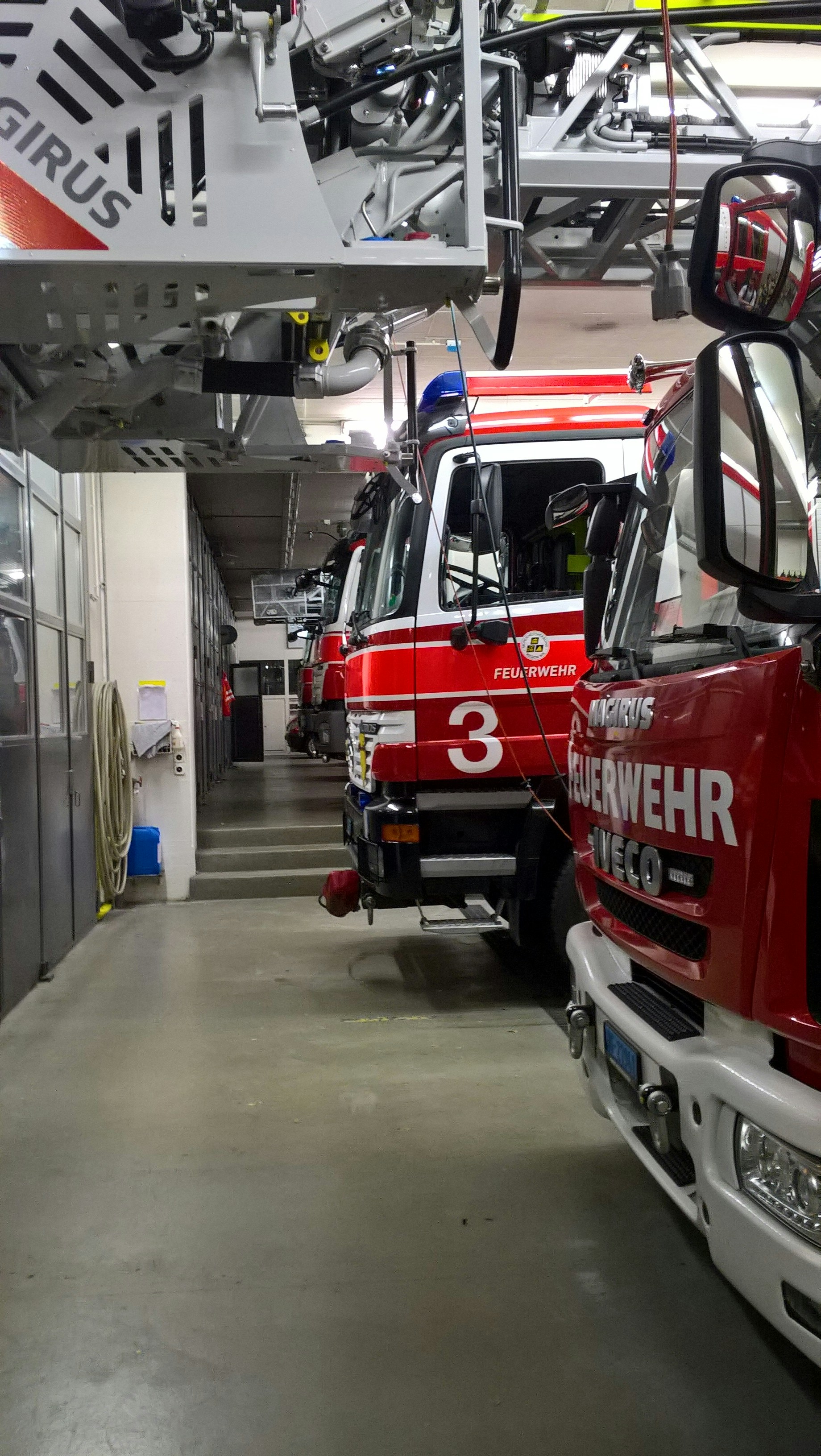 red fire trucks near building