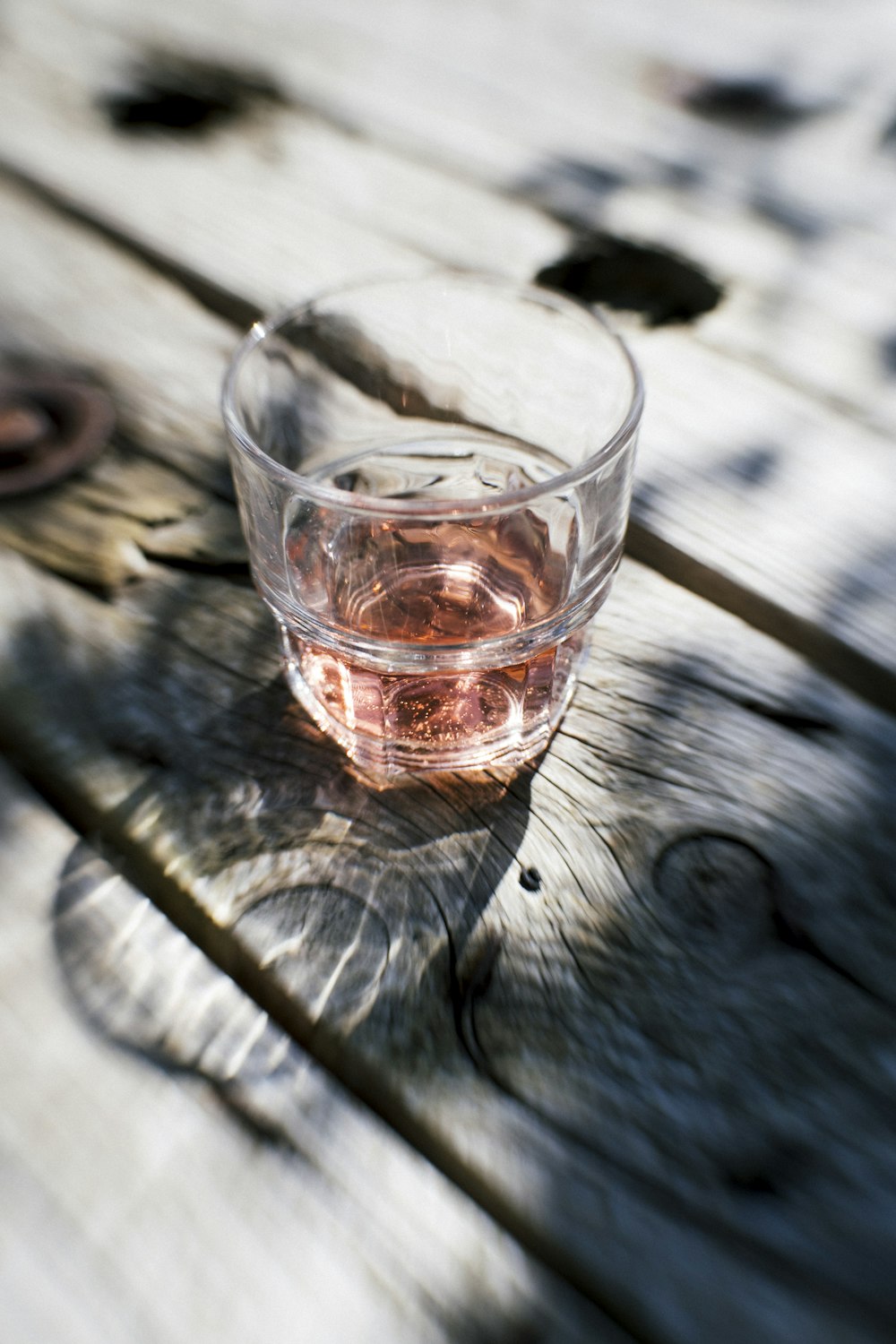 rock glass on brown wooden table