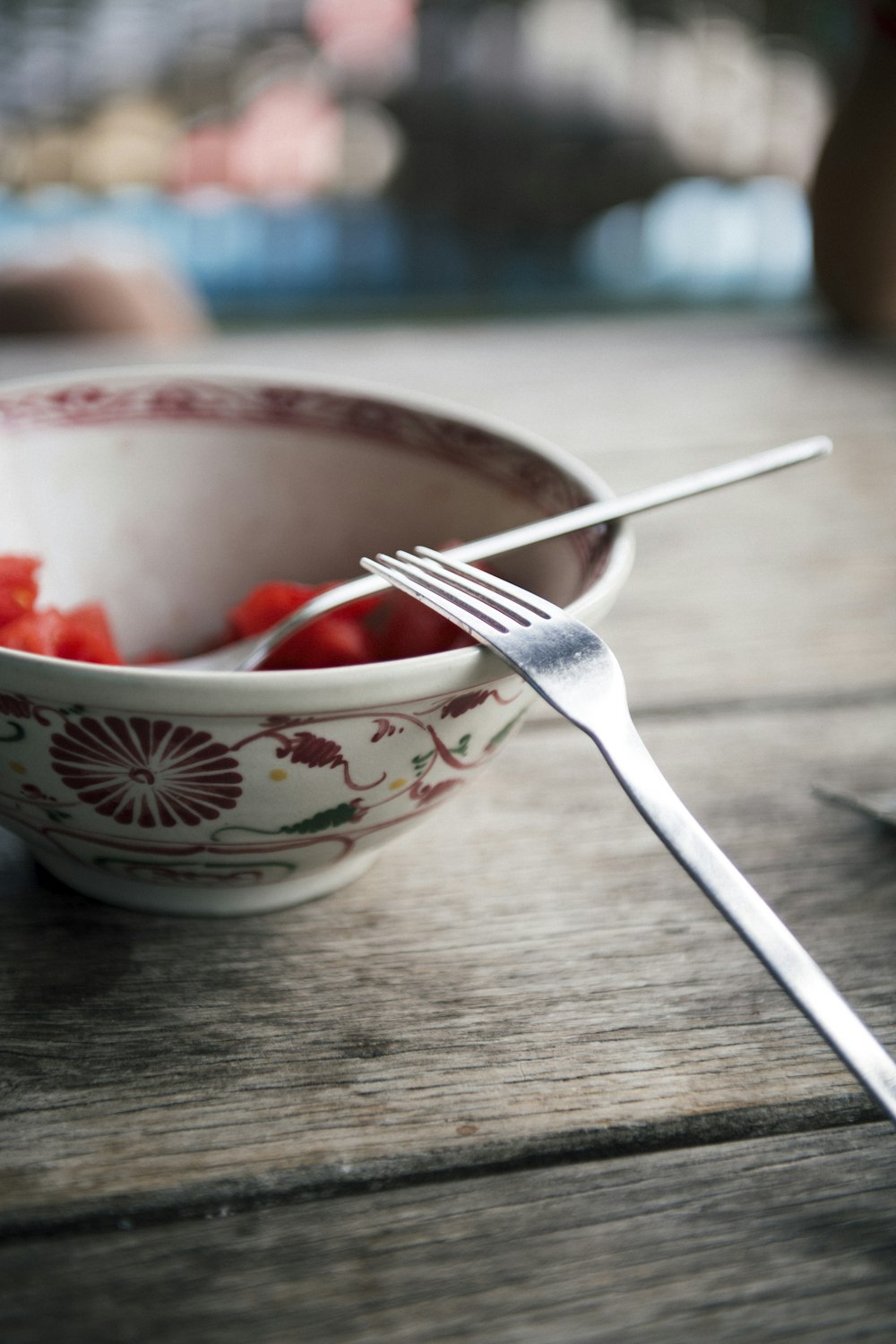 white and red ceramic bowl