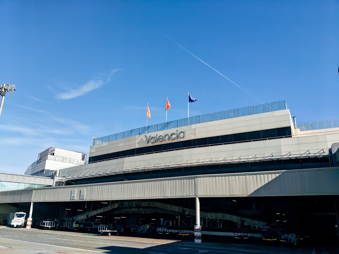 cars parked in front of building during daytime