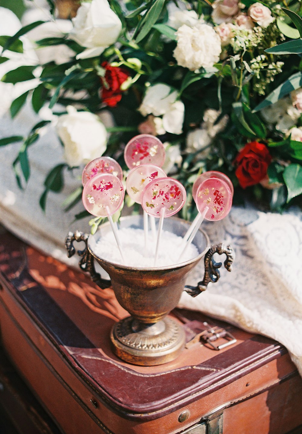 pink lollipop in vase