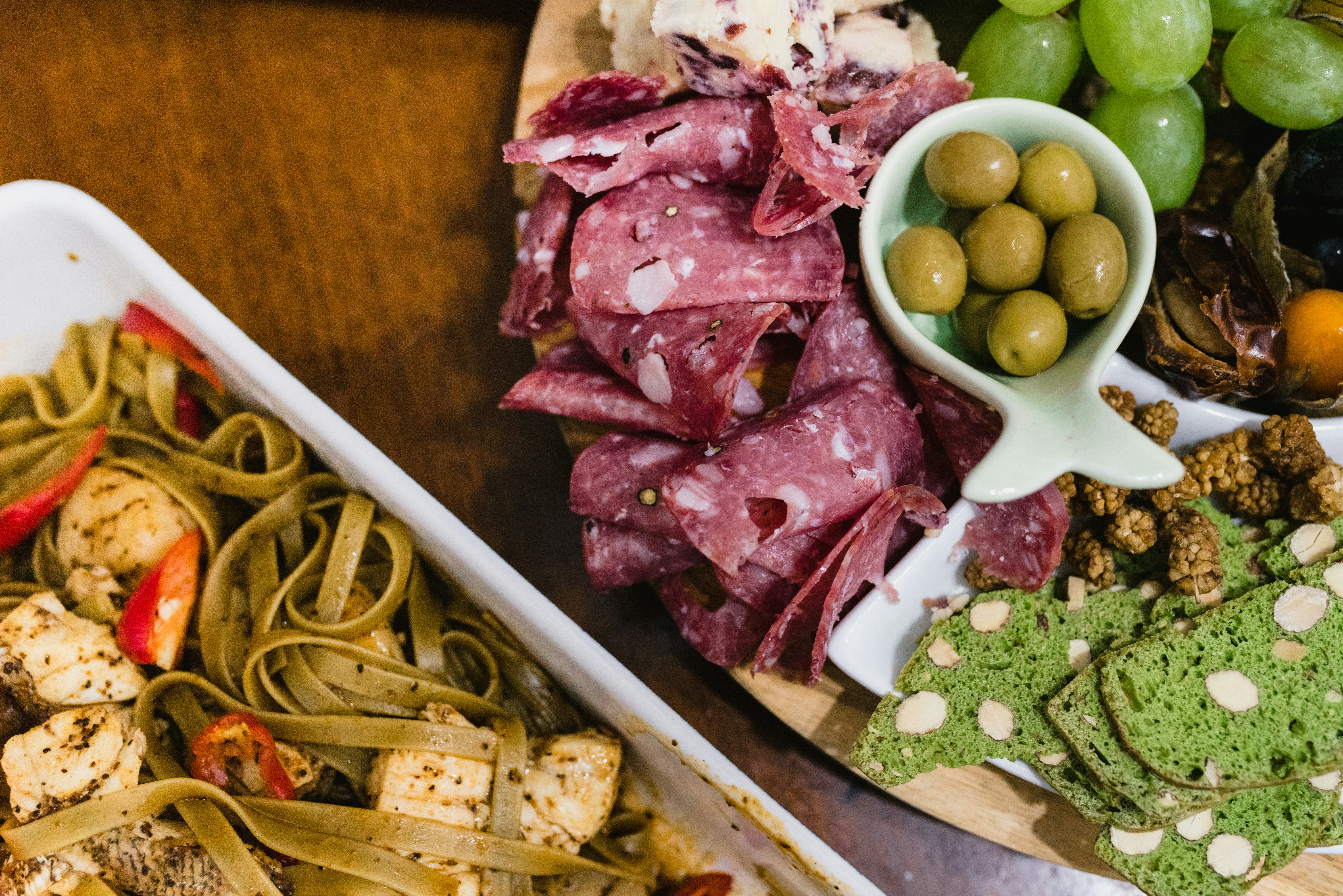 Tray of pasta, cured meats and olives