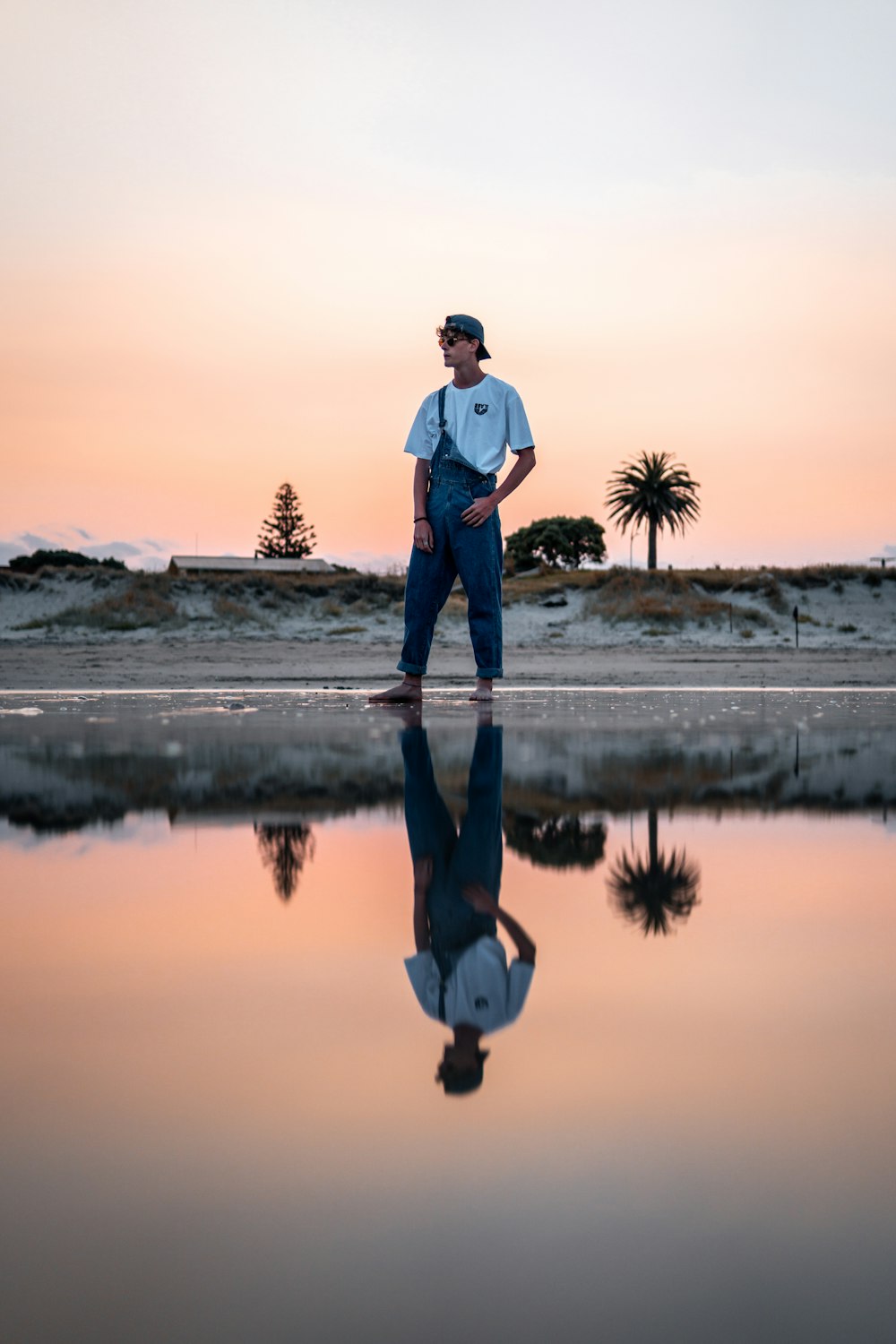 man in blue denim overall pants