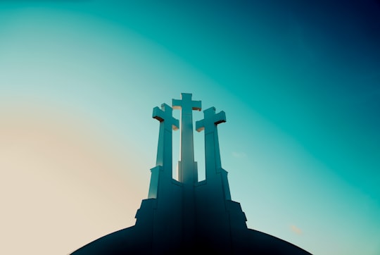 three cross under blue sky cartoon image in Three Crosses Lithuania